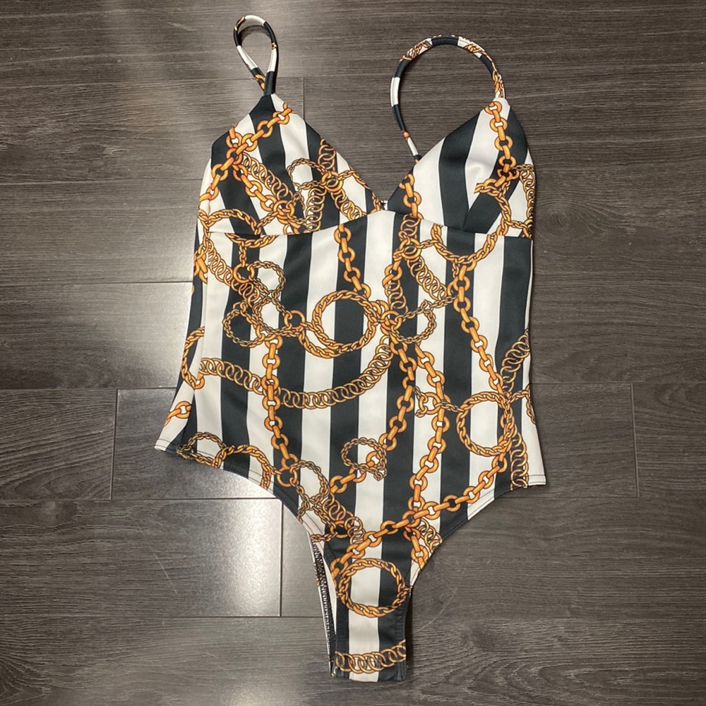 Never worn black & white stripe bodysuit with gold chain print.